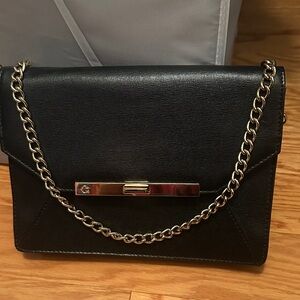 C. Wonder Black Clutch with Gold Chain